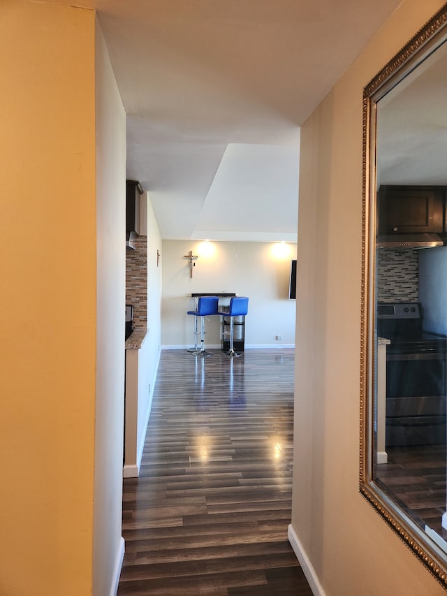 hall with dark hardwood / wood-style floors