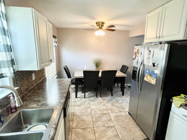 kitchen featuring white cabinets, sink, ceiling fan, tasteful backsplash, and stainless steel fridge with ice dispenser