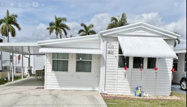 view of front of property with a carport