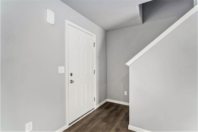 entryway with dark hardwood / wood-style floors