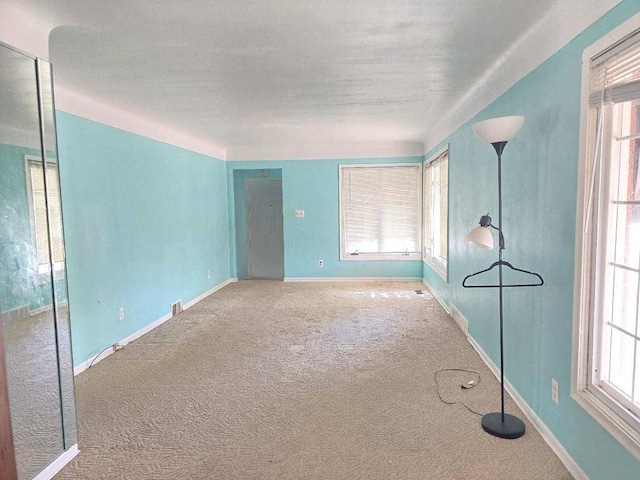 empty room featuring carpet floors