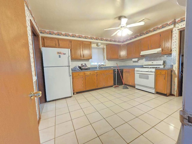 kitchen with ceiling fan, white appliances, sink, and light tile patterned floors