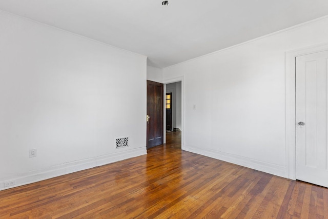 empty room with dark hardwood / wood-style floors