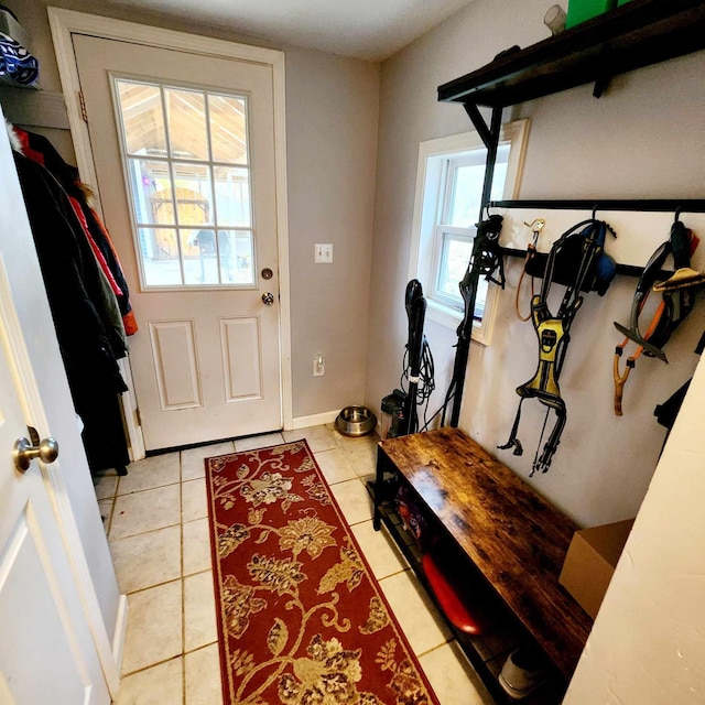 doorway featuring light tile patterned floors