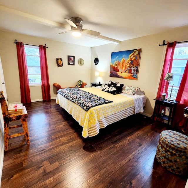 bedroom featuring dark hardwood / wood-style floors, multiple windows, and ceiling fan