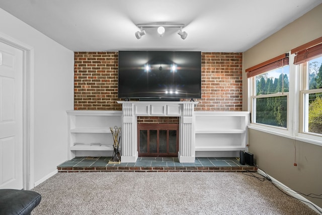 unfurnished living room featuring a fireplace and dark carpet