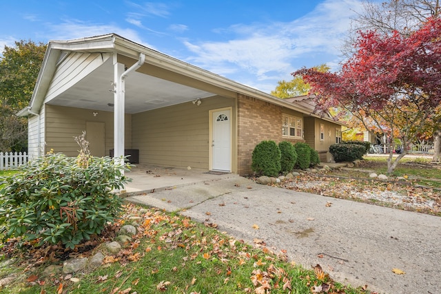 view of front of property featuring a carport