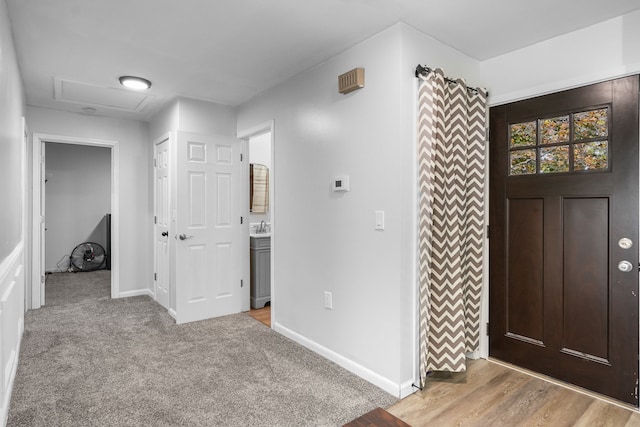 carpeted entryway with sink