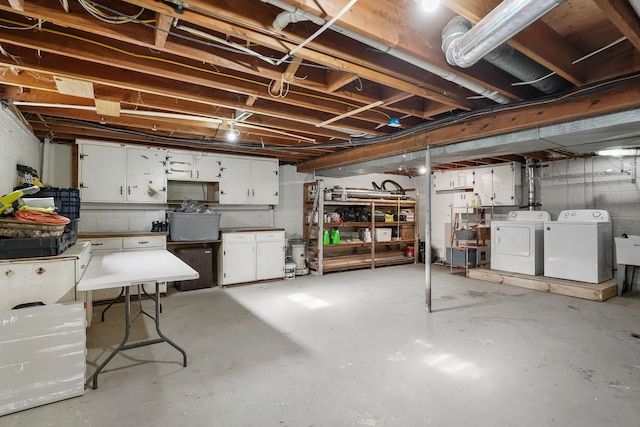 basement featuring washing machine and clothes dryer