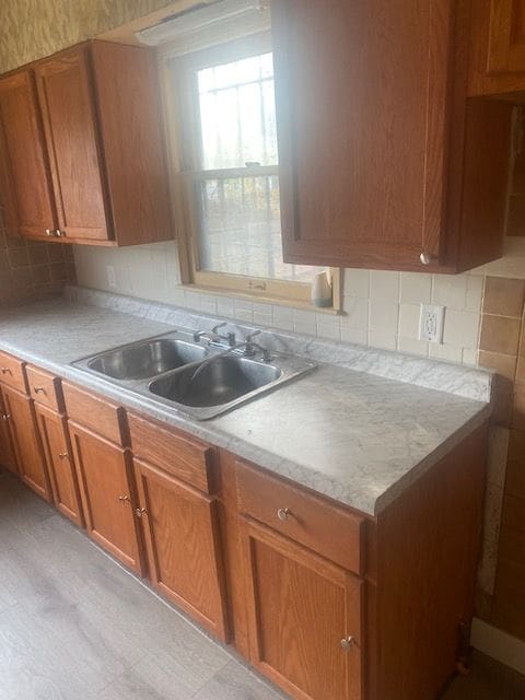 kitchen with tasteful backsplash and sink