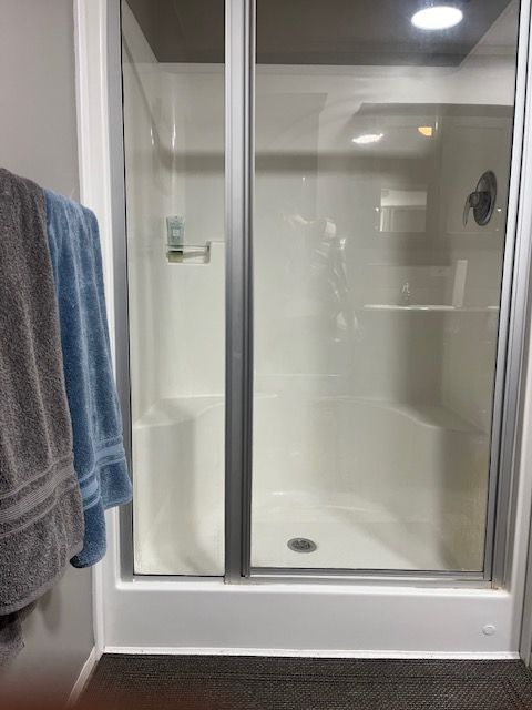 bathroom with an enclosed shower