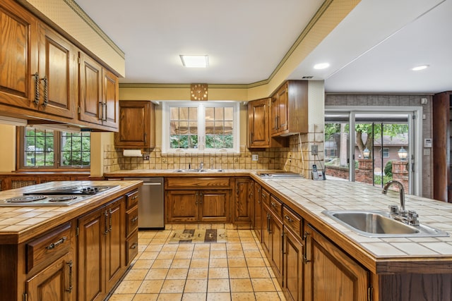 kitchen featuring tile countertops and a wealth of natural light