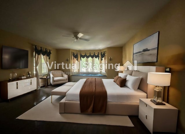 bedroom with dark hardwood / wood-style flooring and ceiling fan