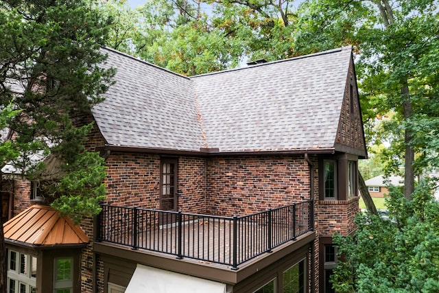 view of side of home with a balcony