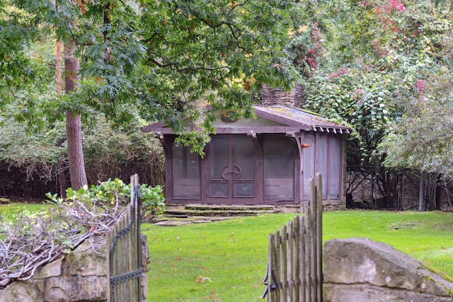 view of outdoor structure with a lawn