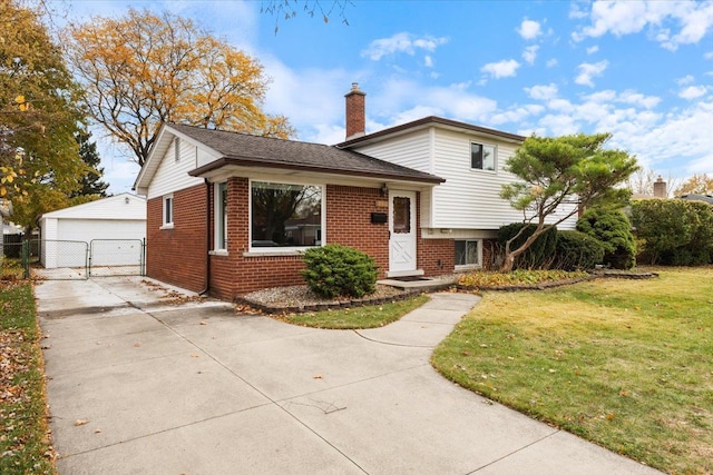 split level home with a garage and a front lawn