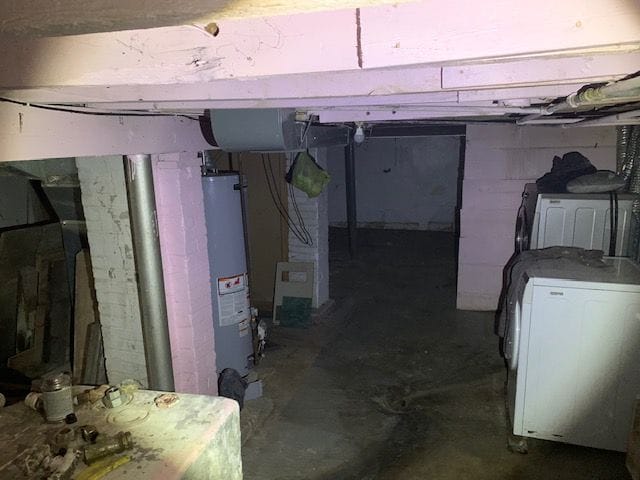 basement featuring washer / clothes dryer and water heater