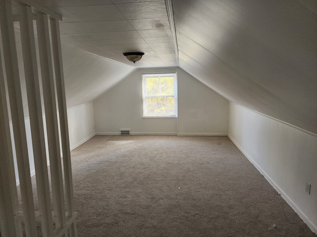 bonus room featuring carpet floors and lofted ceiling