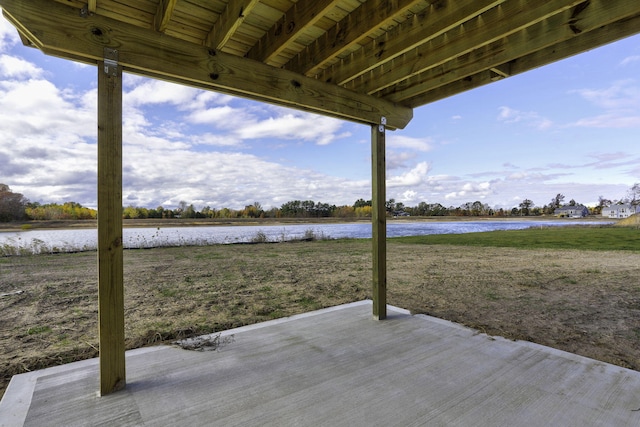 view of patio with a water view