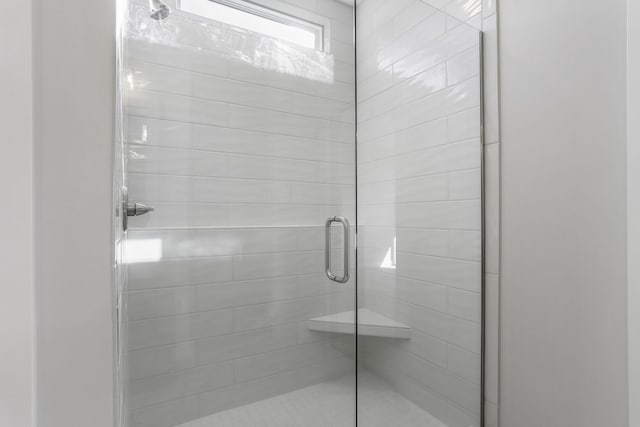 bathroom featuring an enclosed shower