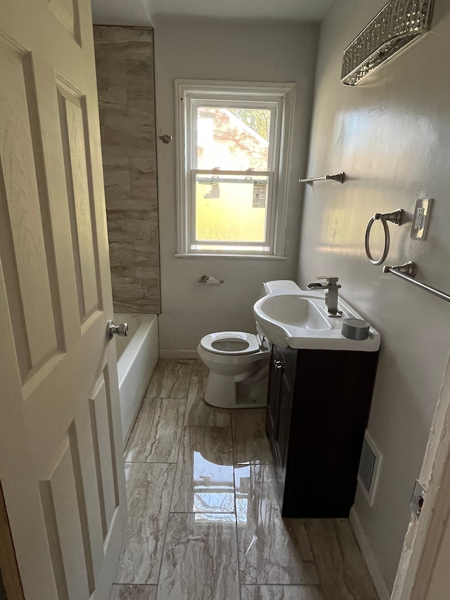 full bathroom with bathing tub / shower combination, vanity, and toilet