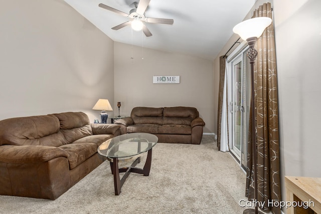 living room featuring carpet, ceiling fan, and lofted ceiling