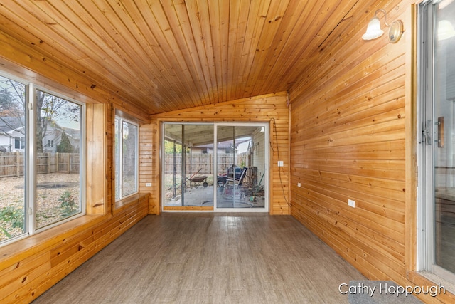 unfurnished sunroom featuring lofted ceiling and wooden ceiling