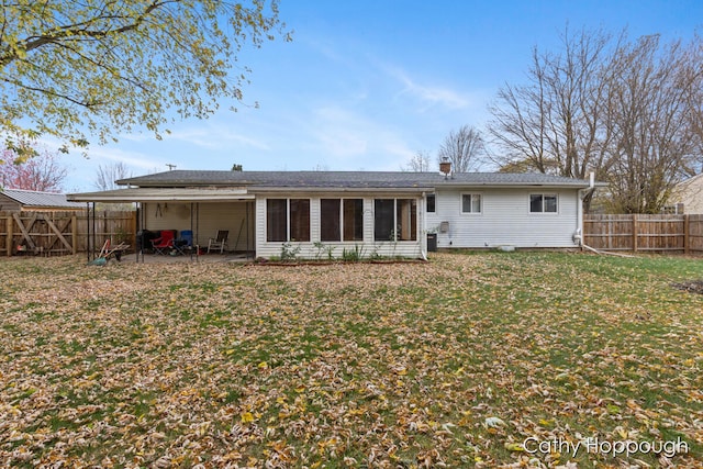 rear view of property with a yard and a patio