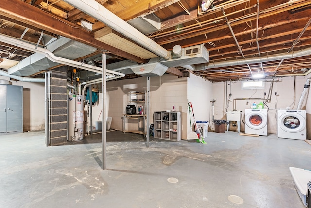 basement with washer and dryer, sink, and water heater