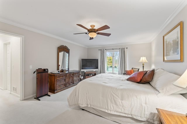 carpeted bedroom featuring ornamental molding and ceiling fan