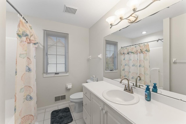 bathroom with vanity, tile patterned floors, and toilet