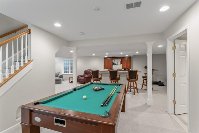 playroom featuring decorative columns, bar, light colored carpet, and billiards