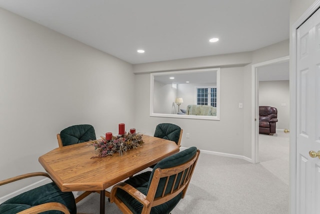 view of carpeted dining space