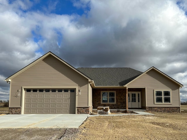 ranch-style home featuring a garage