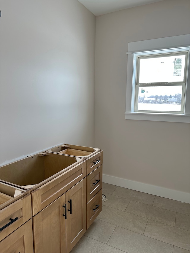 bathroom with tile patterned floors