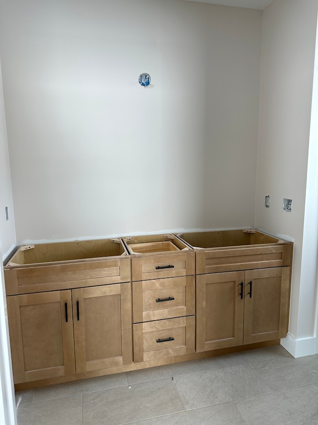 bathroom with tile patterned floors