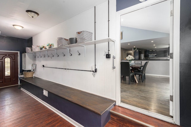 mudroom with lofted ceiling and dark hardwood / wood-style floors