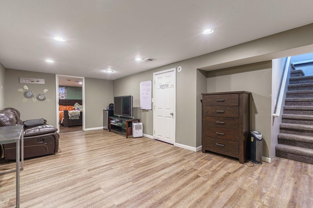 living room with light hardwood / wood-style flooring