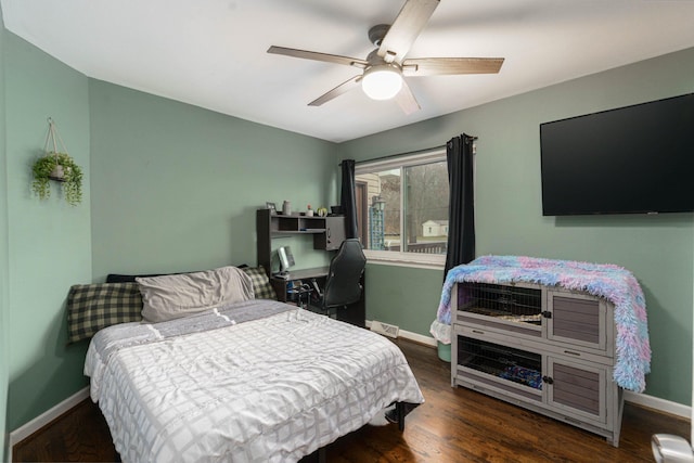 bedroom with ceiling fan and dark wood-type flooring