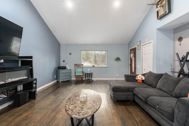 living room with dark hardwood / wood-style flooring and high vaulted ceiling