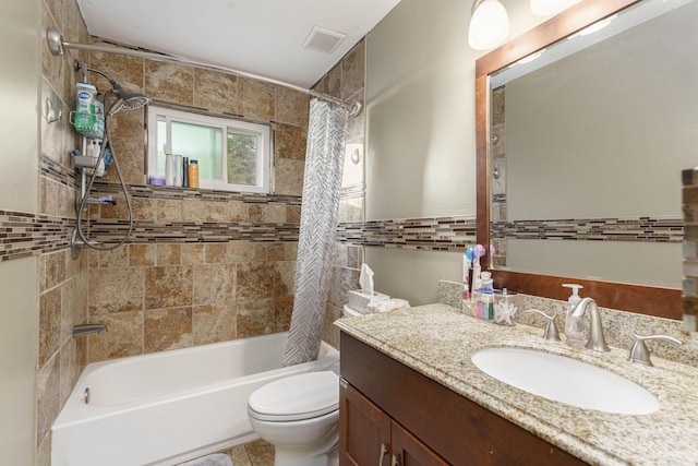 full bathroom with tile patterned flooring, vanity, shower / tub combo, and toilet