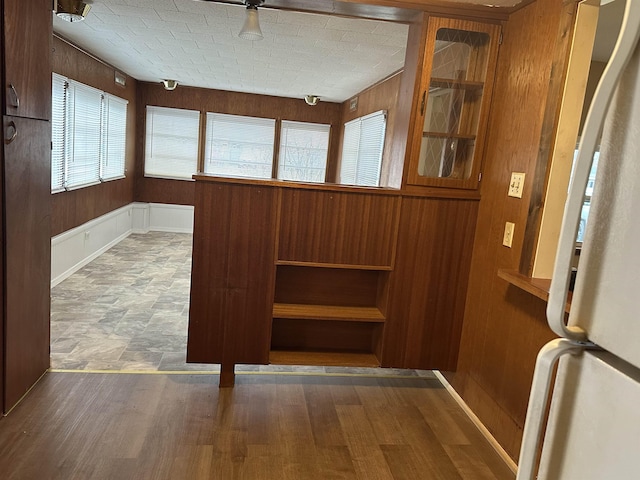 4465 Filter Rd, Harrison, MI 48625 - detailed view of freestanding refrigerator and wooden walls