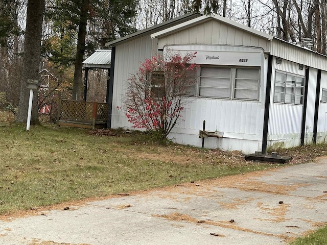 4465 Filter Rd, Harrison, MI 48625 - view of property exterior featuring a lawn