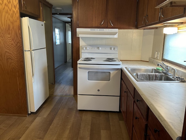 4465 Filter Rd, Harrison, MI 48625 - kitchen featuring white appliances, range hood, a sink, dark wood-style flooring, and light countertops