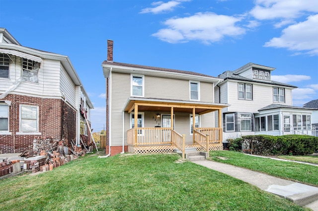 view of front of house with a porch and a front lawn