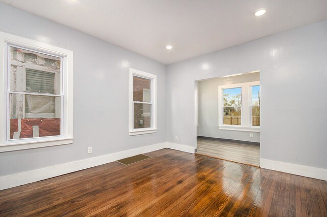 spare room featuring hardwood / wood-style floors