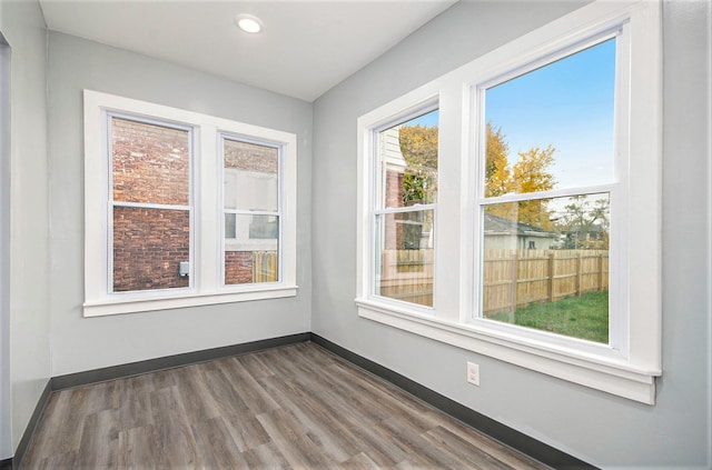 spare room with dark wood-type flooring