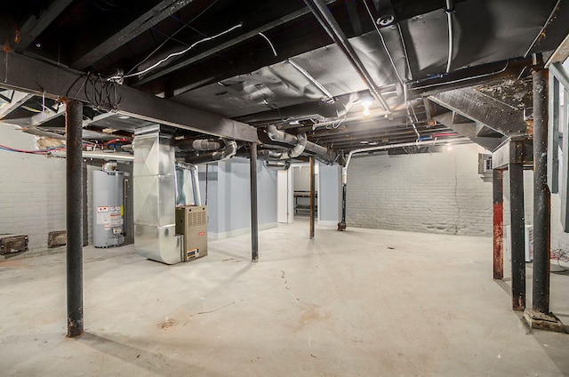 unfinished basement with water heater, brick wall, and heating unit