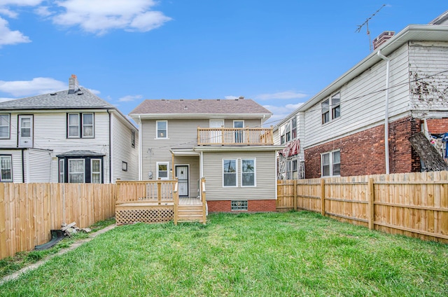 rear view of house featuring a wooden deck, a yard, and a balcony