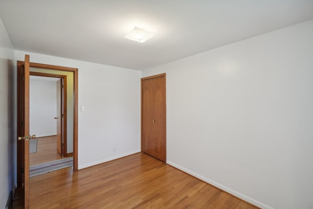 unfurnished room with light hardwood / wood-style flooring